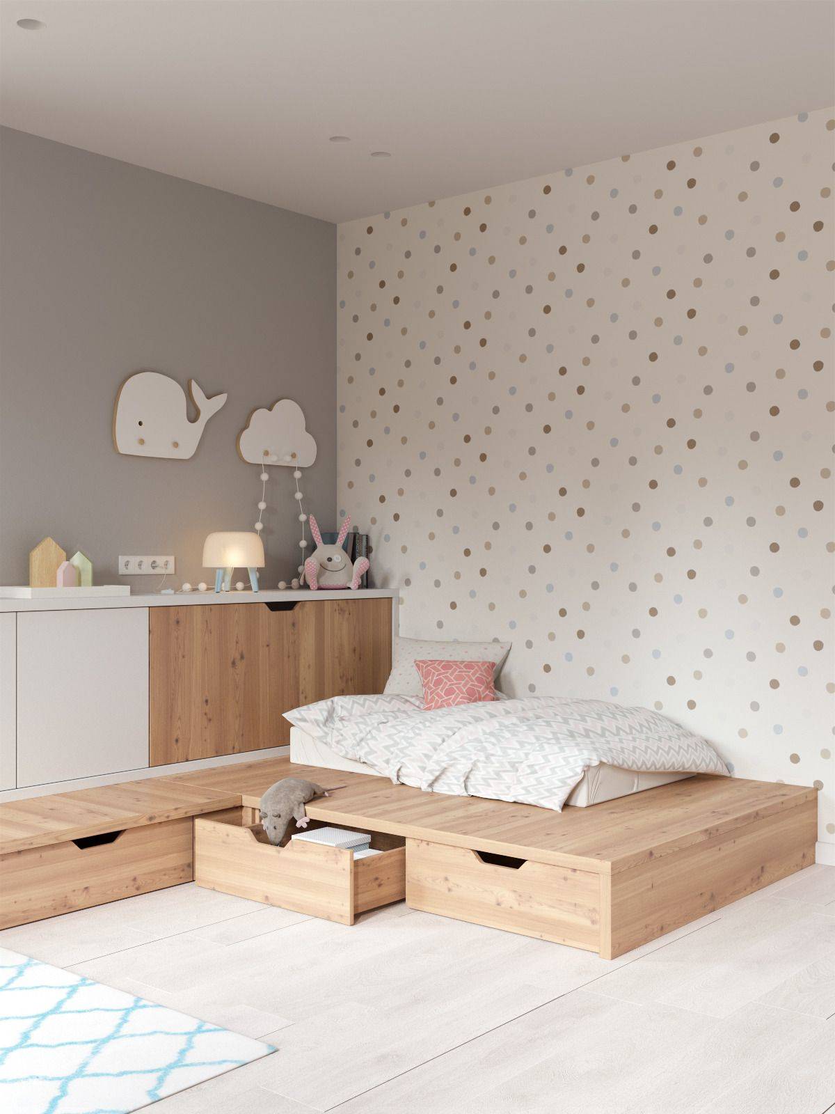 Habitación infantil decorada con el método Montessori con almacenaje bajo la cama