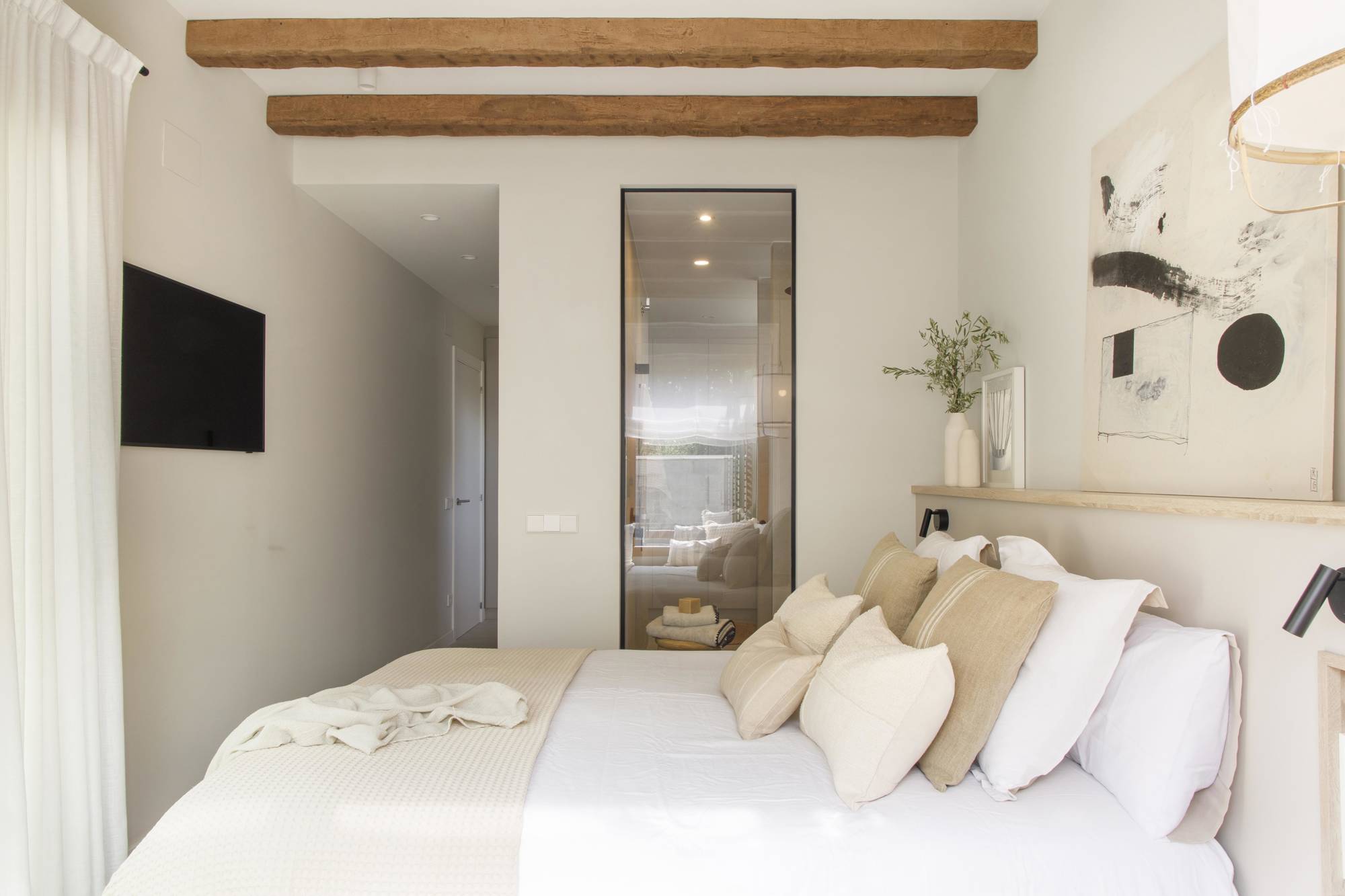 Dormitorio con cerramiento acristalado proyecto de Pia Capdevila